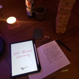 A set up for The Sealed Library using a tumbling tower, notebook, candle, dice and a deck of cards.